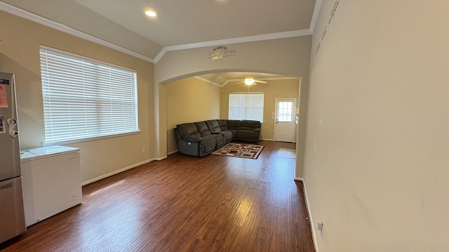 20530 Keegans Ledge Ln, Cypress, TX 77433 - living room featuring arched walkways, ornamental molding, wood finished floors, and recessed lighting