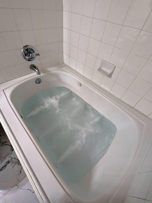 18927 Remington Bend Dr, Houston, TX 77073 - bathroom with marble look tile flooring