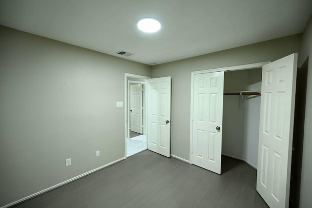 18927 Remington Bend Dr, Houston, TX 77073 - unfurnished bedroom with dark wood-style floors and a closet