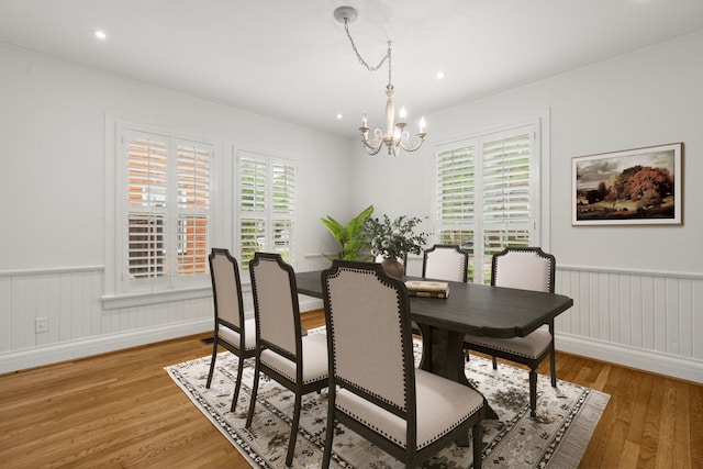 2409 Dryden Rd, Houston, TX 77030 - dining space featuring a chandelier, a wainscoted wall, light wood finished floors, ornamental molding, and recessed lighting