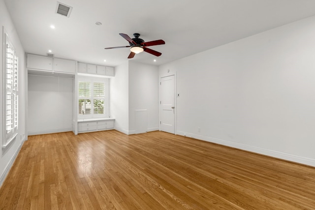 2409 Dryden Rd, Houston, TX 77030 - empty room with light wood-style floors, a ceiling fan, and recessed lighting