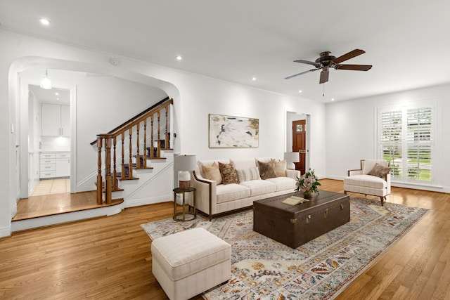 2409 Dryden Rd, Houston, TX 77030 - living room featuring wood finished floors, stairs, a ceiling fan, and recessed lighting