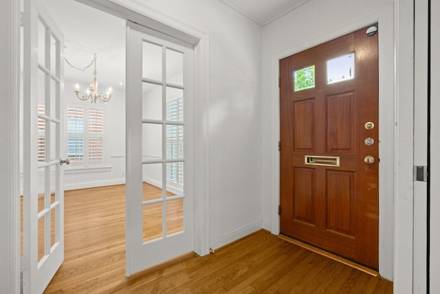 2409 Dryden Rd, Houston, TX 77030 - foyer with a chandelier and wood finished floors