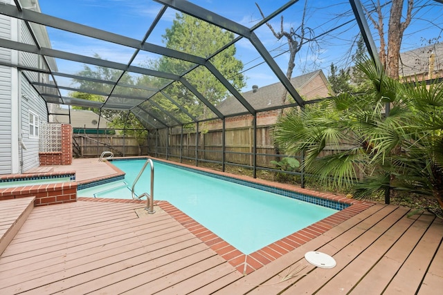 2409 Dryden Rd, Houston, TX 77030 - view of pool featuring a fenced backyard, a lanai, a wooden deck, and a pool with connected hot tub