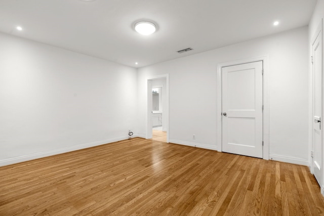 2409 Dryden Rd, Houston, TX 77030 - unfurnished bedroom with light wood-style floors, recessed lighting, and ensuite bath