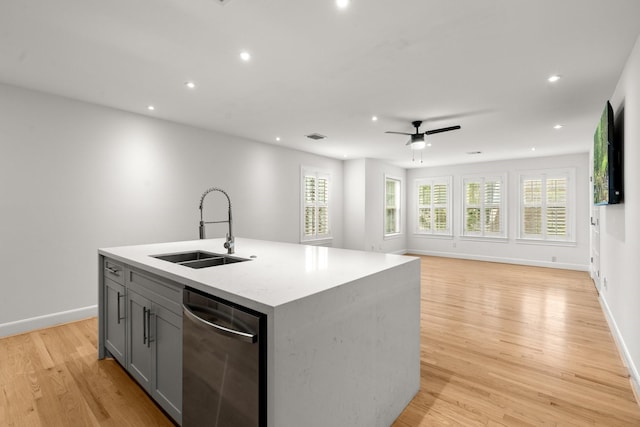 2409 Dryden Rd, Houston, TX 77030 - kitchen with stainless steel dishwasher, gray cabinets, ceiling fan, light wood-style flooring, and recessed lighting