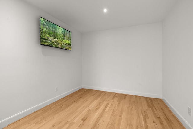 2409 Dryden Rd, Houston, TX 77030 - empty room with light wood-style flooring and recessed lighting