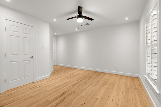 2409 Dryden Rd, Houston, TX 77030 - spare room with light wood-style flooring, a ceiling fan, and recessed lighting