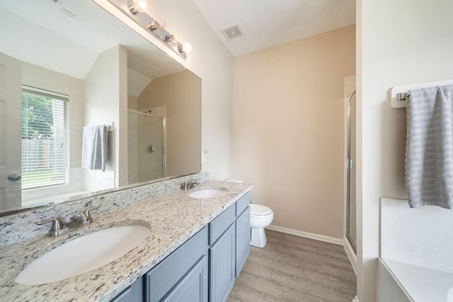 3261 Gladewater Ln, League City, TX 77573 - bathroom featuring a shower stall, double vanity, and wood finished floors