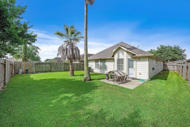 3261 Gladewater Ln, League City, TX 77573 - back of house featuring a fenced backyard, a shingled roof, and a patio
