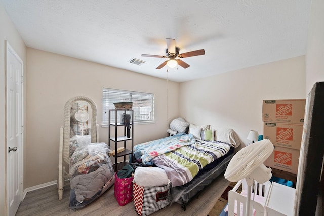 3261 Gladewater Ln, League City, TX 77573 - bedroom with wood finished floors and a ceiling fan