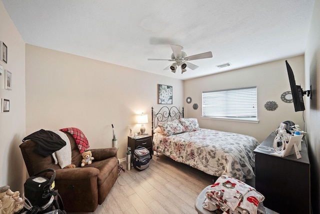 3261 Gladewater Ln, League City, TX 77573 - bedroom with wood finished floors and ceiling fan