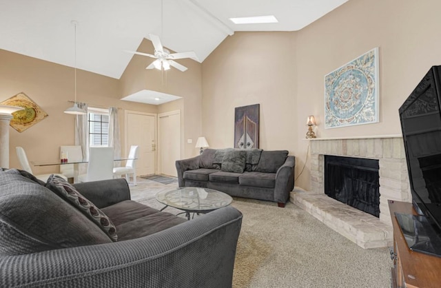 9809 Richmond Ave Unit 8, Houston, TX 77042 - living room with a ceiling fan, a brick fireplace, carpet flooring, a skylight, and high vaulted ceiling