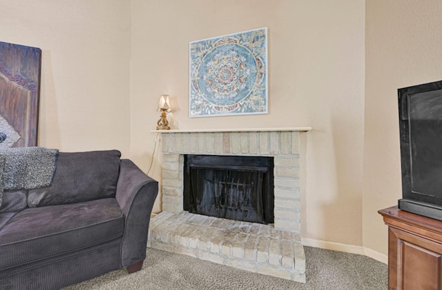 9809 Richmond Ave Unit 8, Houston, TX 77042 - carpeted living area with a fireplace and baseboards