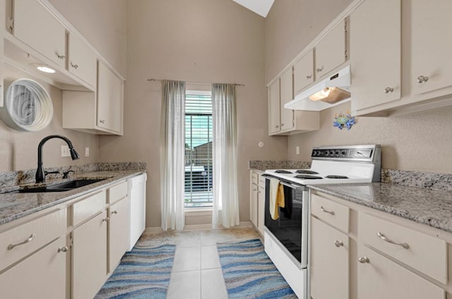 9809 Richmond Ave Unit 8, Houston, TX 77042 - kitchen with white electric range oven, under cabinet range hood, dishwashing machine, a high ceiling, and light tile patterned flooring