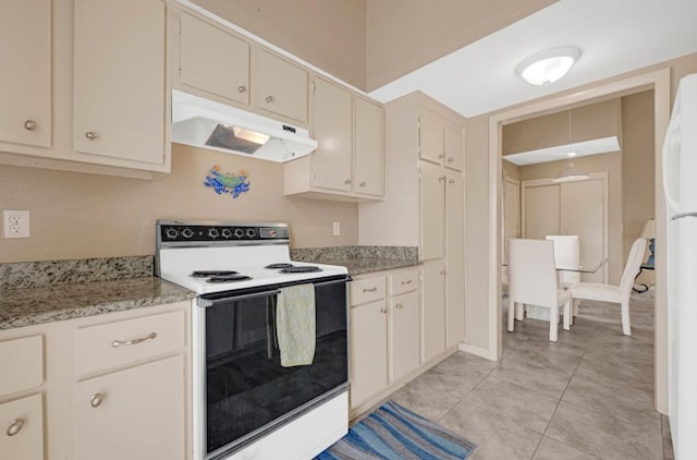 9809 Richmond Ave Unit 8, Houston, TX 77042 - kitchen with white appliances, under cabinet range hood, light tile patterned floors, cream cabinetry, and light stone countertops
