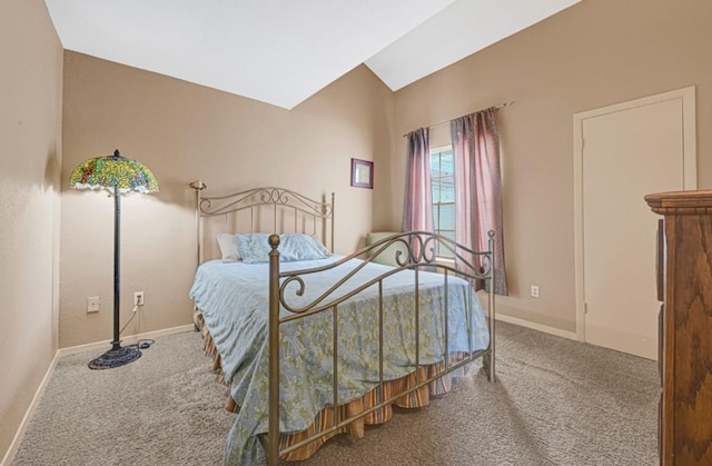 9809 Richmond Ave Unit 8, Houston, TX 77042 - carpeted bedroom with baseboards and lofted ceiling
