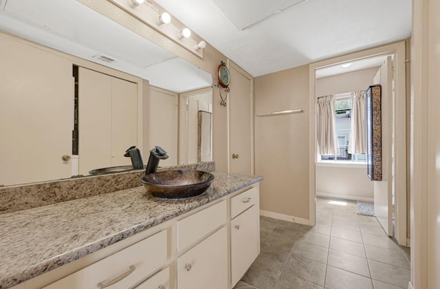 9809 Richmond Ave Unit 8, Houston, TX 77042 - bathroom with vanity and tile patterned floors