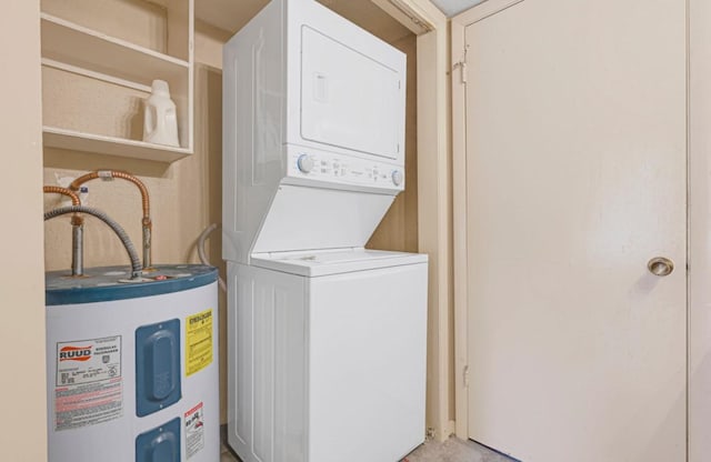 9809 Richmond Ave Unit 8, Houston, TX 77042 - washroom featuring estacked washer and dryer and water heater