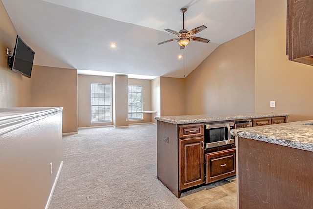 2315 Huldy St, Houston, TX 77019 - kitchen featuring stainless steel microwave, a ceiling fan, light colored carpet, lofted ceiling, and recessed lighting