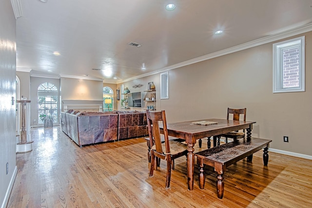 2315 Huldy St, Houston, TX 77019 - dining room featuring light wood-style floors, crown molding, and recessed lighting