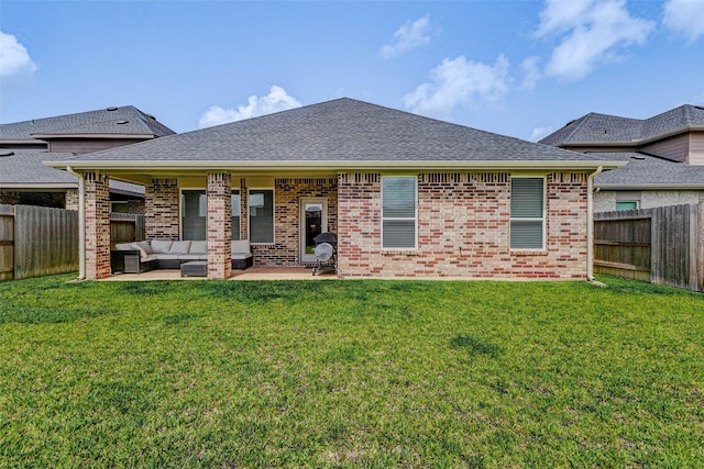 3368 Voda Bend Dr, Katy, TX 77493 - back of house featuring an outdoor hangout area, a patio, a fenced backyard, brick siding, and a shingled roof