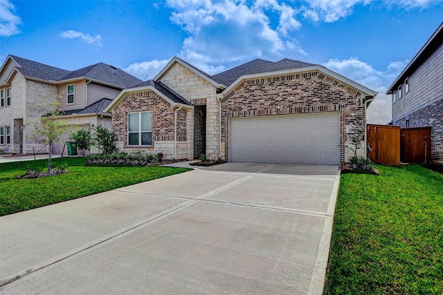 3368 Voda Bend Dr, Katy, TX 77493 - view of front of property featuring an attached garage, driveway, brick siding, and stone siding