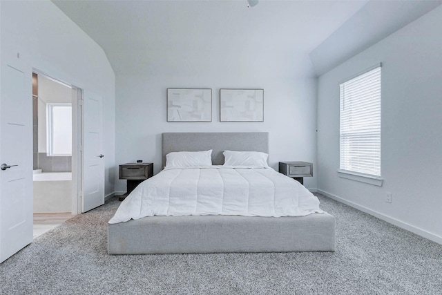 3368 Voda Bend Dr, Katy, TX 77493 - carpeted bedroom with multiple windows, lofted ceiling, and ensuite bath