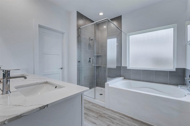 3368 Voda Bend Dr, Katy, TX 77493 - full bath with a shower stall, a bath, wood finished floors, and double vanity