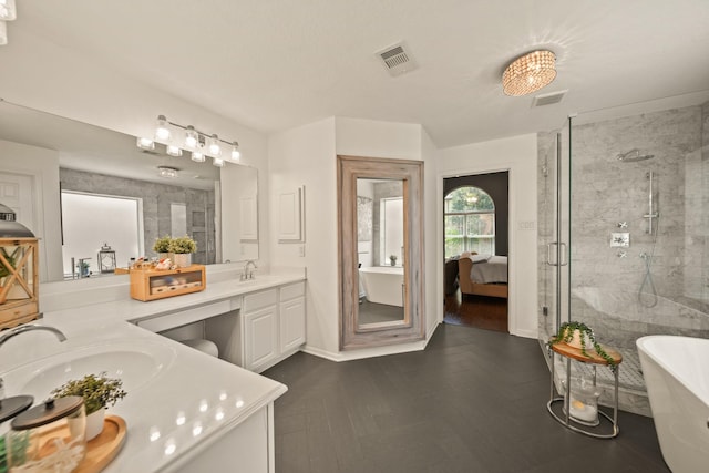 3803 Caleb Ln, Missouri City, TX 77459 - bathroom with double vanity, a freestanding bath, a shower stall, and ensuite bathroom