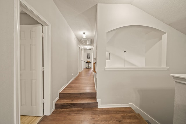 3803 Caleb Ln, Missouri City, TX 77459 - hallway with wood finished floors, lofted ceiling, and a textured ceiling