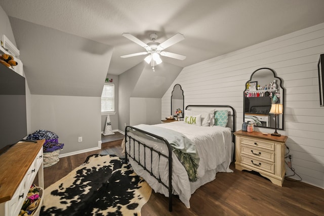 3803 Caleb Ln, Missouri City, TX 77459 - bedroom featuring wood walls, lofted ceiling, dark wood finished floors, and a ceiling fan