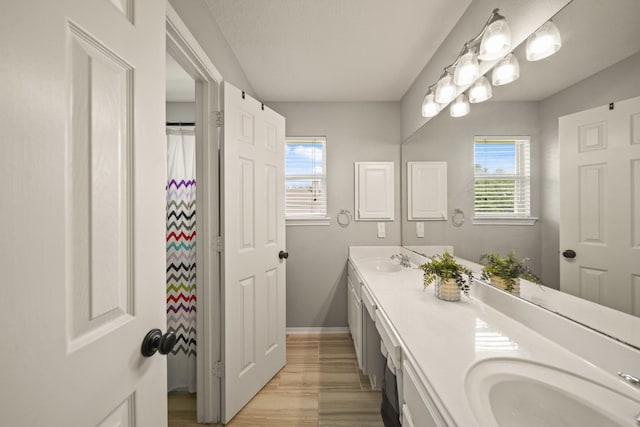 3803 Caleb Ln, Missouri City, TX 77459 - bathroom with double vanity and baseboards