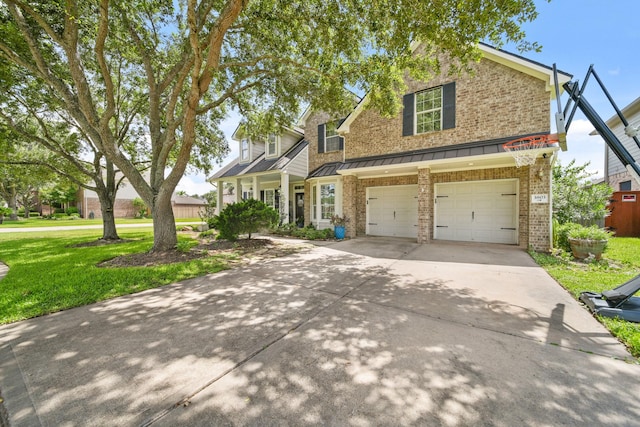 3803 Caleb Ln, Missouri City, TX 77459 - traditional-style home with a front lawn, brick siding, driveway, a garage, and a standing seam roof