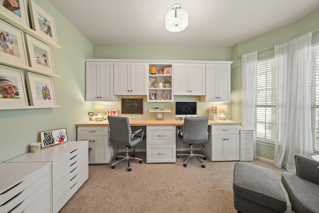 3803 Caleb Ln, Missouri City, TX 77459 - office area with built in desk, light carpet, and plenty of natural light