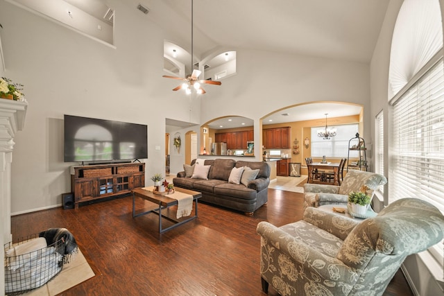 3803 Caleb Ln, Missouri City, TX 77459 - living room with arched walkways, a ceiling fan, high vaulted ceiling, wood finished floors, and a chandelier