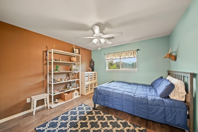 3803 Caleb Ln, Missouri City, TX 77459 - bedroom with wood finished floors and a ceiling fan