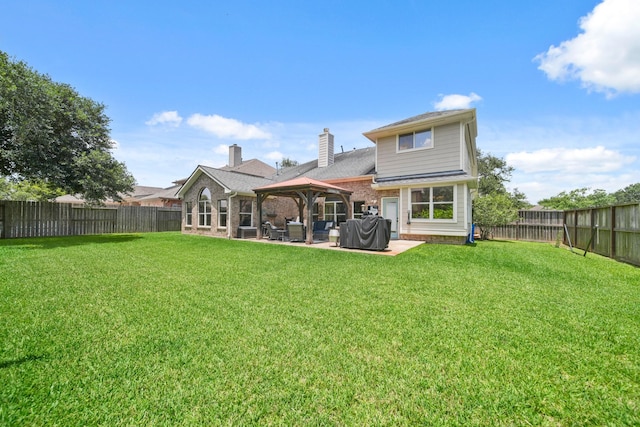 3803 Caleb Ln, Missouri City, TX 77459 - back of property featuring a gazebo, a patio, a fenced backyard, brick siding, and a chimney