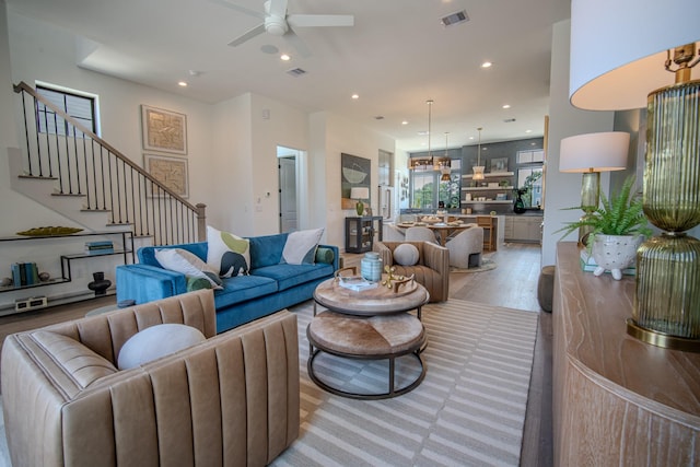 1720 Sedola Ln, Houston, TX 77055 - living room with ceiling fan, stairs, recessed lighting, and light wood-type flooring