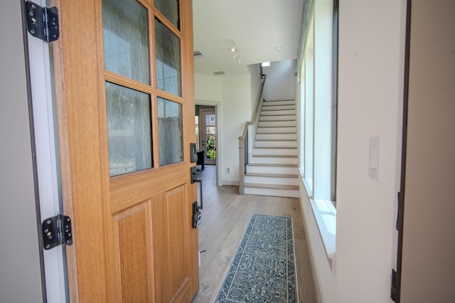 1720 Sedola Ln, Houston, TX 77055 - entryway with light wood-type flooring and stairway