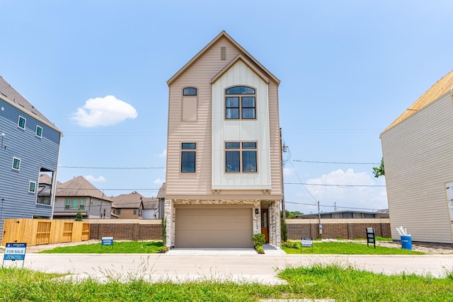 1720 Sedola Ln, Houston, TX 77055 - view of front facade with an attached garage, concrete driveway, and board and batten siding