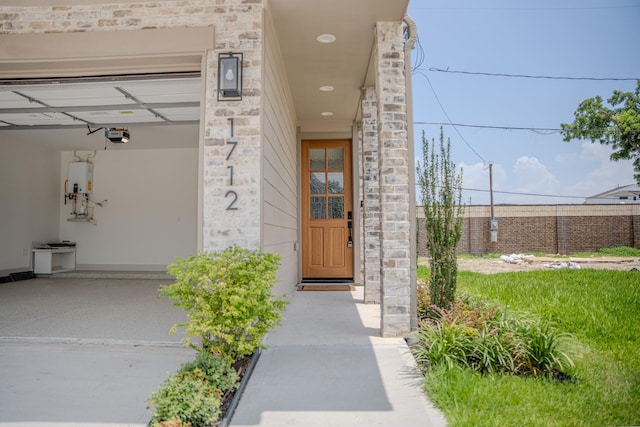 1720 Sedola Ln, Houston, TX 77055 - doorway to property featuring stone siding and tankless water heater