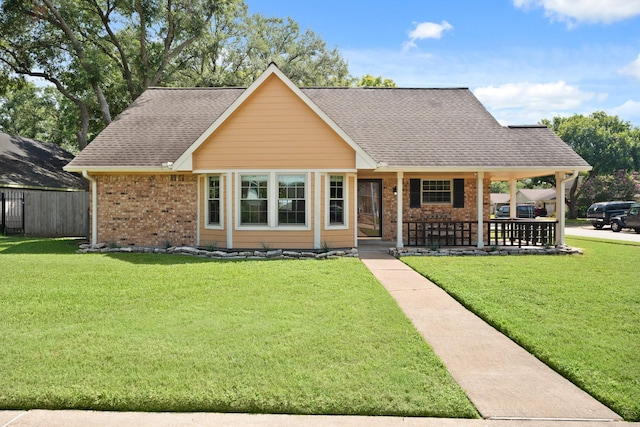 2101 Rocky Creek Ln, Pearland, TX 77581 - view of front of property featuring a porch, brick siding, and a shingled roof