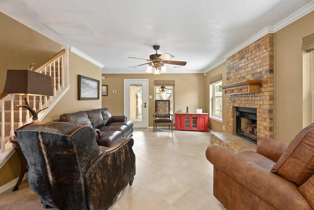 2101 Rocky Creek Ln, Pearland, TX 77581 - living room with stairs, a fireplace, ceiling fan, crown molding, and light tile patterned flooring