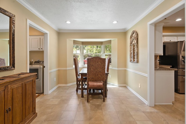 2101 Rocky Creek Ln, Pearland, TX 77581 - dining area with washer and clothes dryer, a textured ceiling, recessed lighting, ornamental molding, and light tile patterned flooring