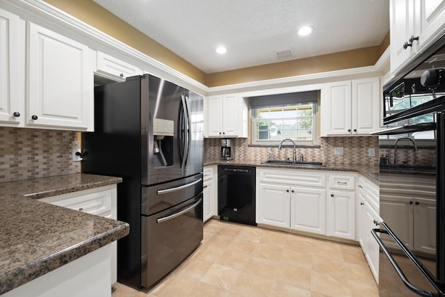 2101 Rocky Creek Ln, Pearland, TX 77581 - kitchen featuring black appliances, white cabinets, tasteful backsplash, recessed lighting, and dark stone countertops