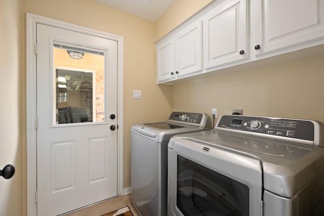 2101 Rocky Creek Ln, Pearland, TX 77581 - laundry room featuring independent washer and dryer and cabinet space