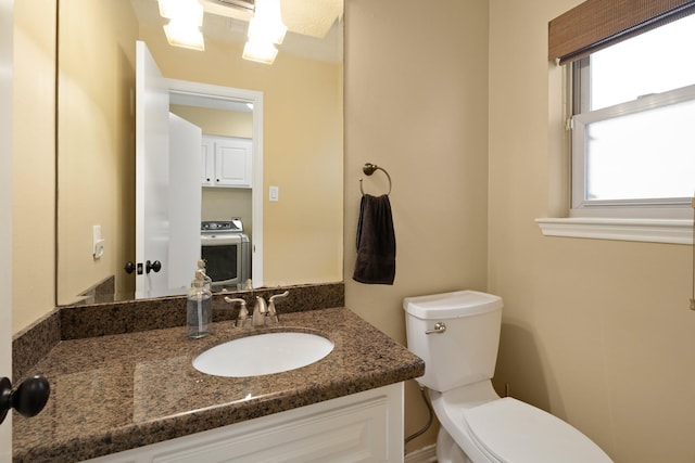 2101 Rocky Creek Ln, Pearland, TX 77581 - bathroom with washer / clothes dryer and vanity
