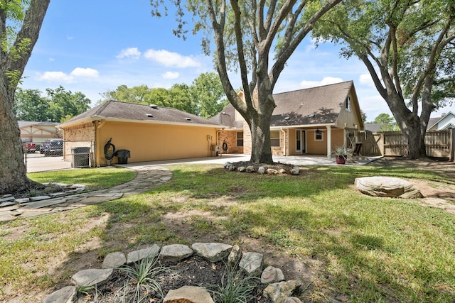 2101 Rocky Creek Ln, Pearland, TX 77581 - rear view of property featuring a patio area and a garage