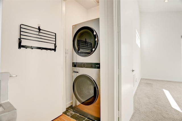 2232 Leeland St, Houston, TX 77003 - laundry room featuring stacked washer and clothes dryer and baseboards